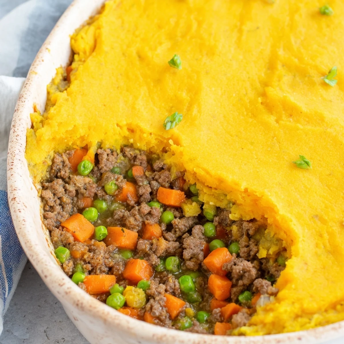 Savory ground beef and vegetables topped with creamy cauliflower mash for a low-carb Shepherds Pie dinner.