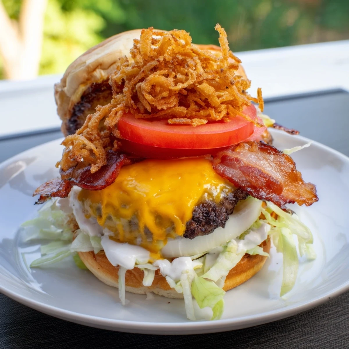 The finished Crack Burgers recipe served on a wooden board with lettuce and tomato, alongside a side of golden sweet potato fries for an American meal.