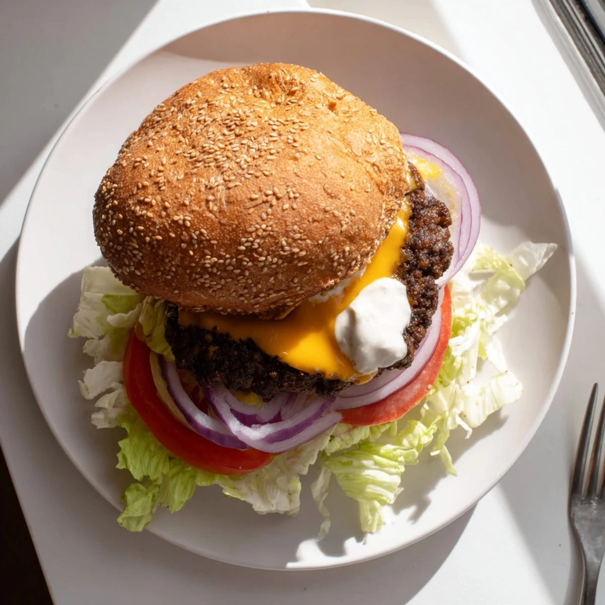 Classic American smash burger topped with melted cheese, pickles, and burger sauce on buttery bun