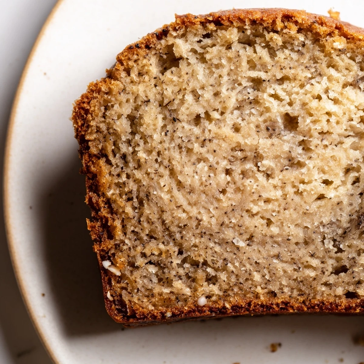 Deliciously moist banana bread slice showing the soft fluffy texture ideal for breakfast or dessert