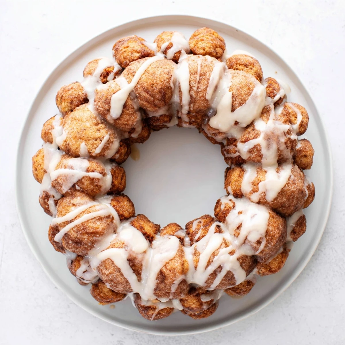 Golden high protein no sugar monkey bread with cinnamon coating in a bundt pan