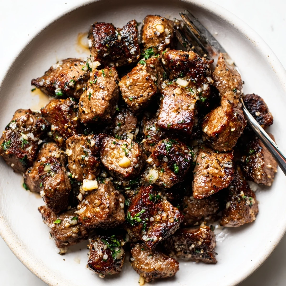 Garlic Butter Steak Bites tossed in fragrant butter sauce, sprinkled with sea salt