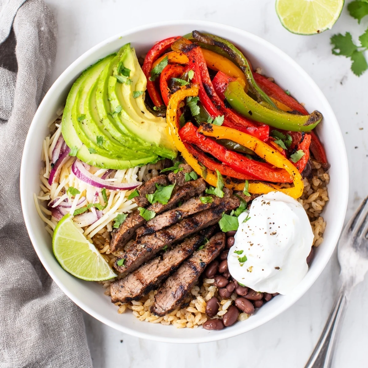 Steak Fajita Power Bowls with sizzling steak, charred peppers, avocado slices