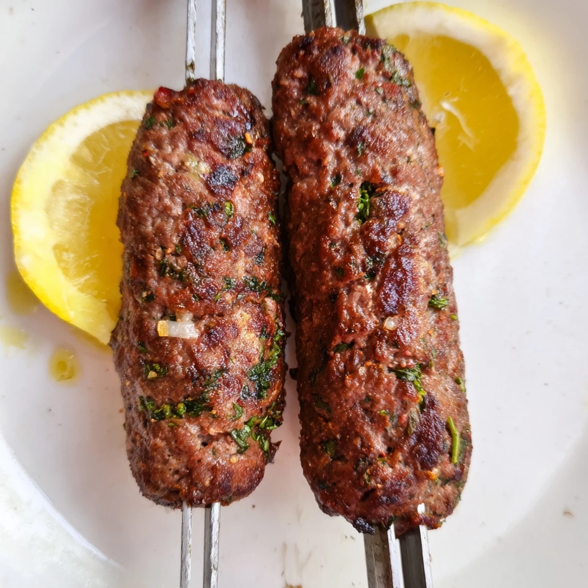Middle Eastern Lamb Kofta Kebabs spiced with cumin and mint, perfectly grilled over open flame