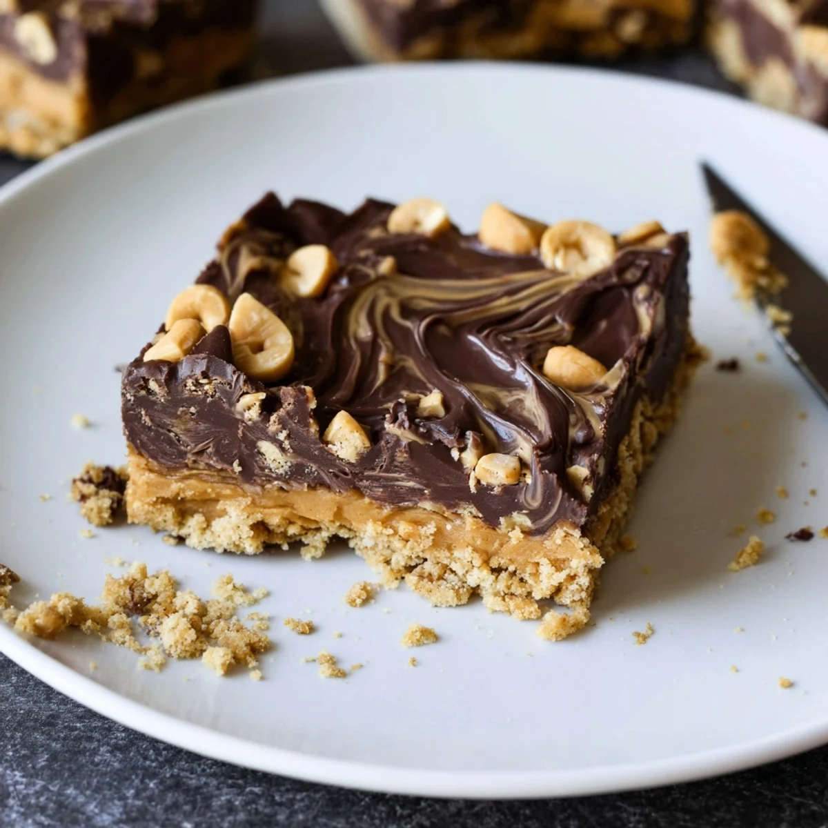 Peanut Butter Bars with glossy chocolate topping, chilled and cut into squares